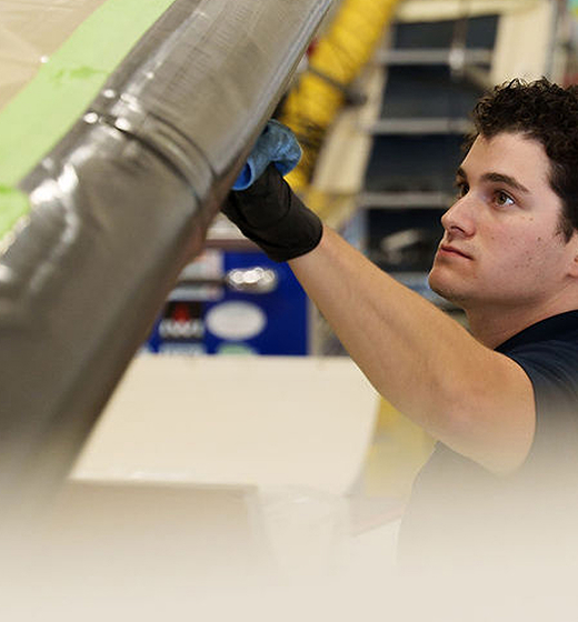 Aviation worker performing detailed work