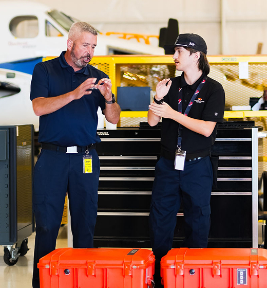 FoxTrot employees discussing aviation services